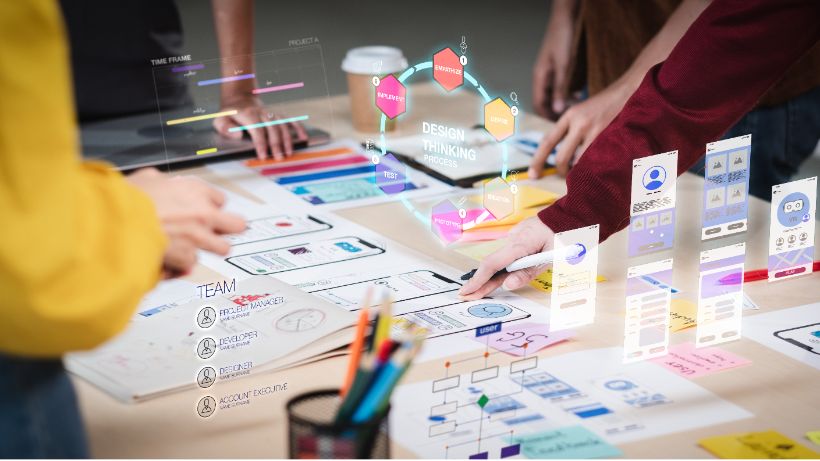 Close up ux developer and ui designer use augmented reality brainstorming about mobile app interface wireframe design on desk at modern office.Creative digital development agency